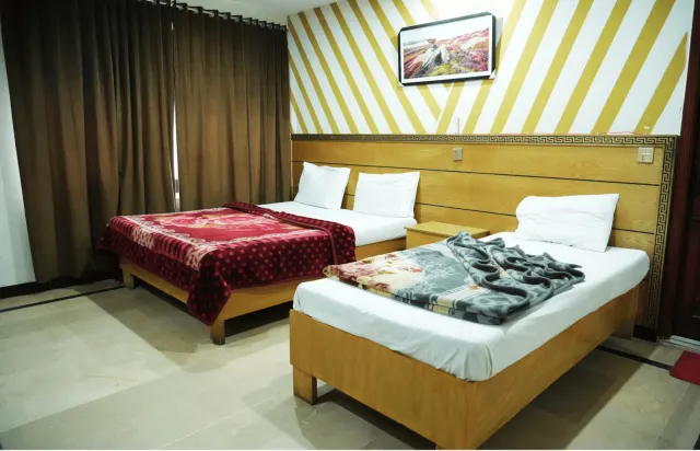 One Room, Two Bed Styles